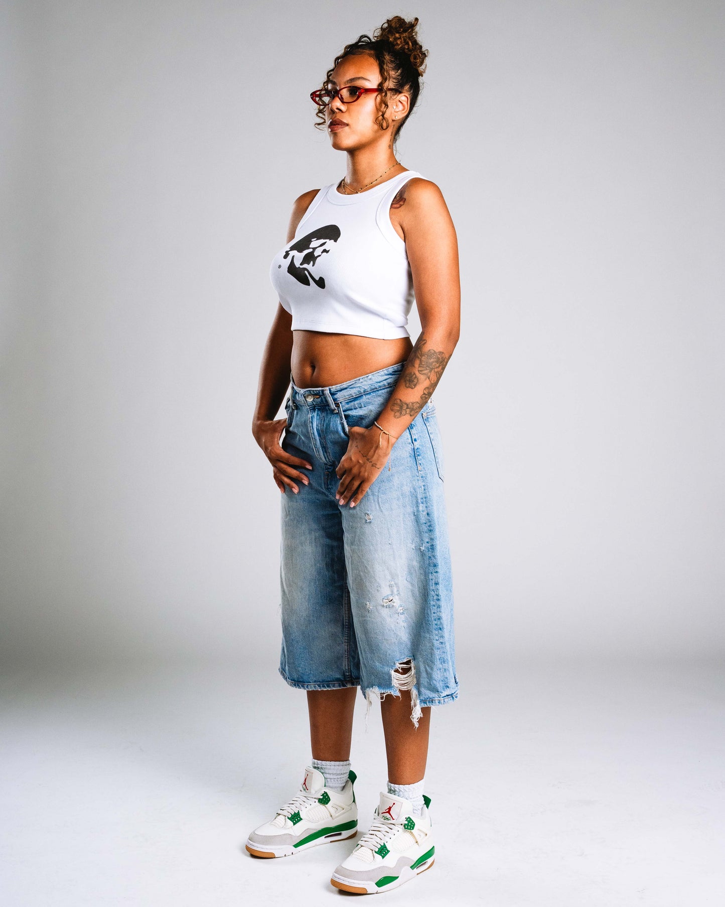 Skelly Basic, A Woman's White Tank (Black Logo)